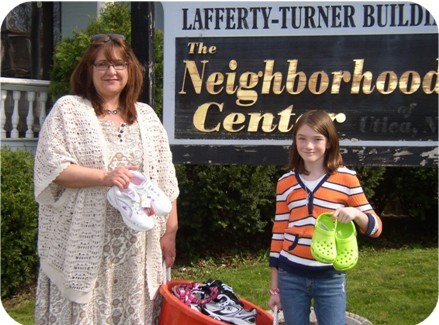 (Pictured left to right:  Sandra Soroka, Executive Director, The Neighborhood Center, Inc., Amanda Grace Lindsay, 10 yrs. old, Utica)