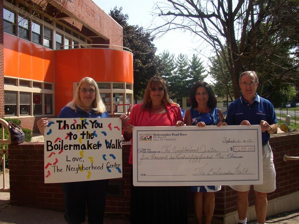 (Pictured R to L: Tim Reed, Executive Director, Boilermaker, Amy Mielnicki, Board President, The Marie A. Russo Neighborhood Center Institute, Inc., Sandra Soroka, Executive Director, The Neighborhood Center, Inc., Marie Seiselmyer, Boilermaker Walk)