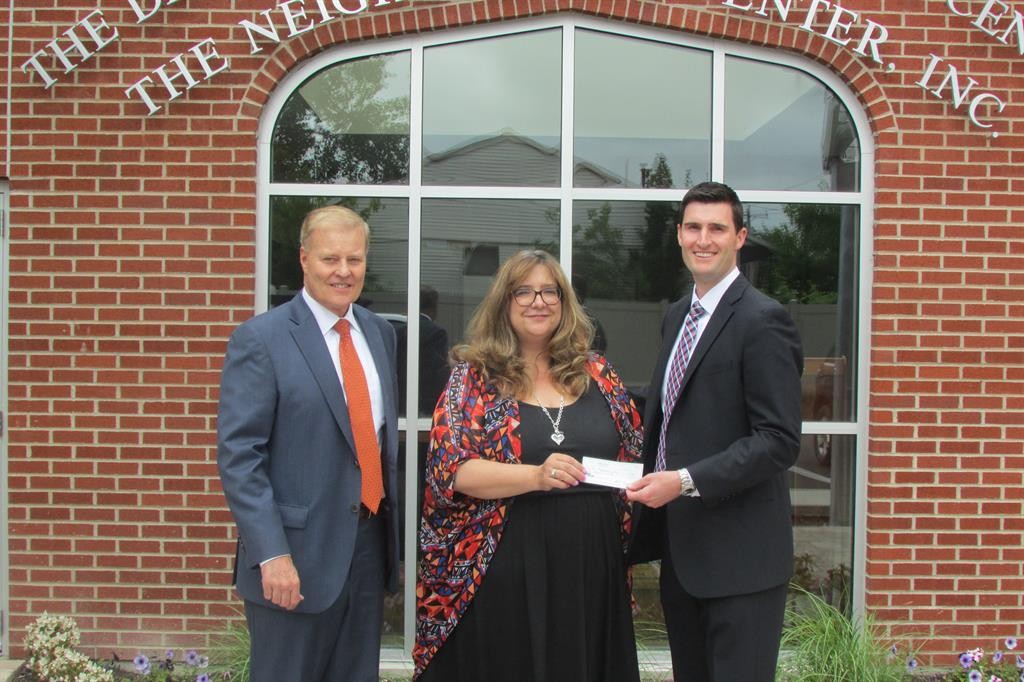 (Blake Ford & Brant Ford of Ford, English Financial Group, LLC. and Estate Strategies pictured with Sandra Soroka, Executive Director, The Neighborhood Center, Inc.)