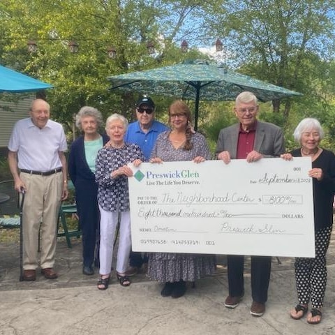 Preswick Glen Donates Funds to The Neighborhood Center Inc.